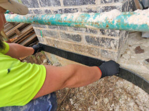 Installing termite proofing on a building