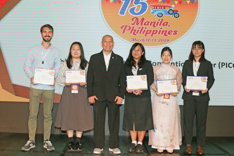 Group of students on stage accepting an award