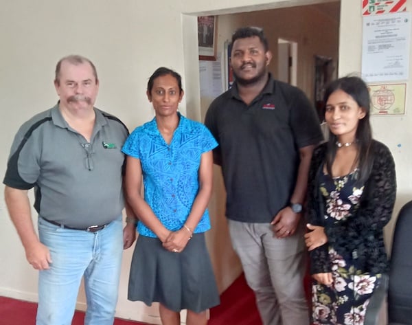 Gary Cochrane pictured with Mohammed Tazim and the Flick Hygiene team in Suva