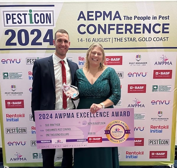Sue-Ann Tysoe collecting the 2024 AWPMA Excellence Award with partner Luke Tysoe
