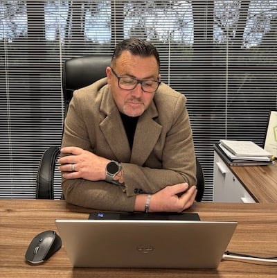 Rik Trotter, managing director of the Pink Pest Group, sitting at a desk