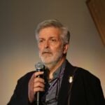 Man speaking into a microphone