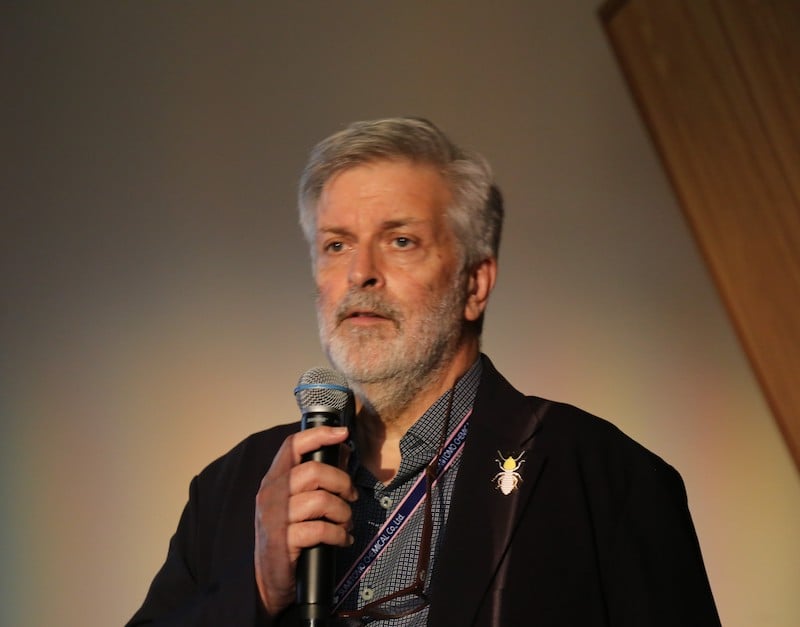 Man speaking into a microphone