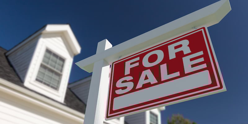 For sale sign outside a house
