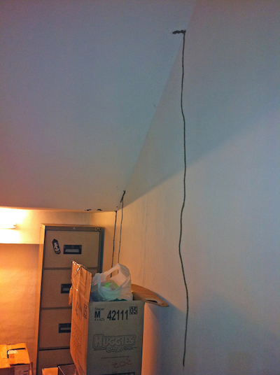 Termite shelter tubes on the wall of a house in Southeast Asia