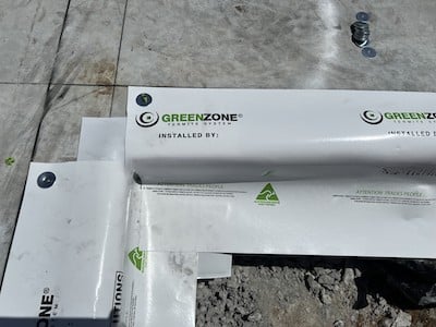 Two sheets of plastic meeting at a right angle as part of a building construction project