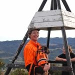 Predator Free Dunedin project manager, Jonah Kitto-Verhoef, with detection dog Scout