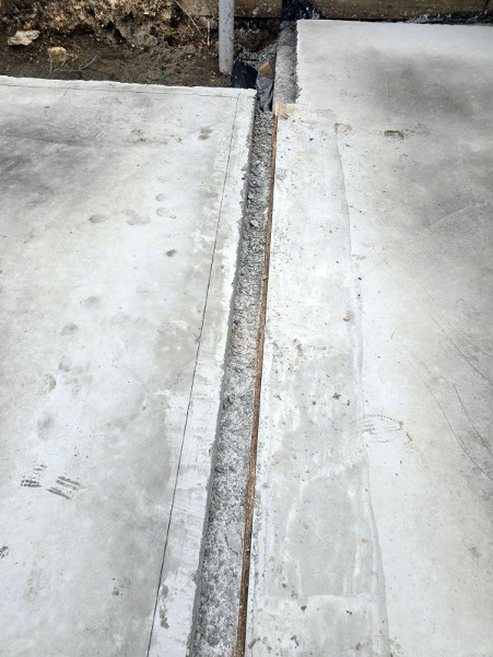 Two concrete slabs next to each other with a gap in the middle
