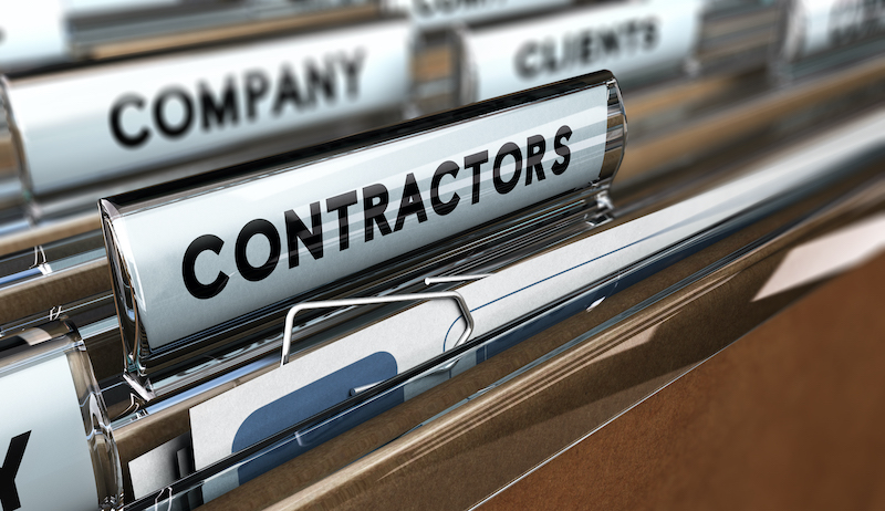 Rows of paper files with one labelled Contractors