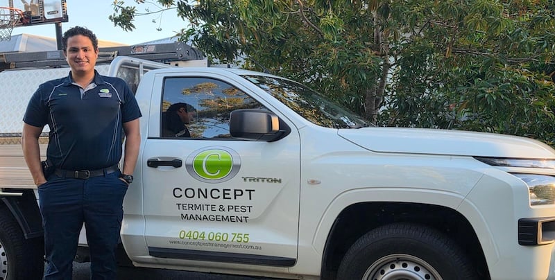 Hernan Garcia-Prieto from Concept Termite and Pest Management with his branded vehicle