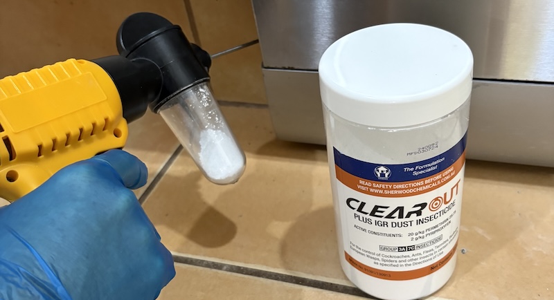 Sherwood Clearout Plus IGR Dust being applied in a kitchen using an E-duster application tool